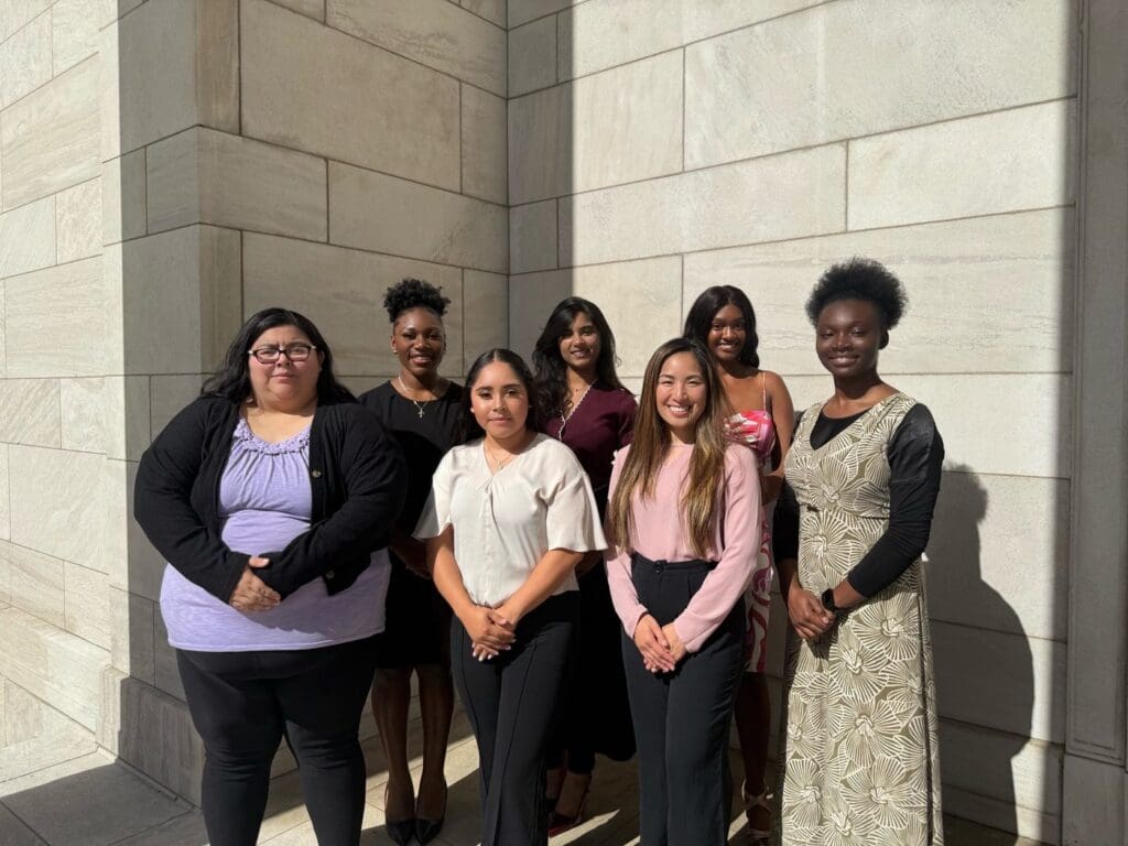 The 2025 to 2026 Global Governance Fellowship cohort standing together outdoors.