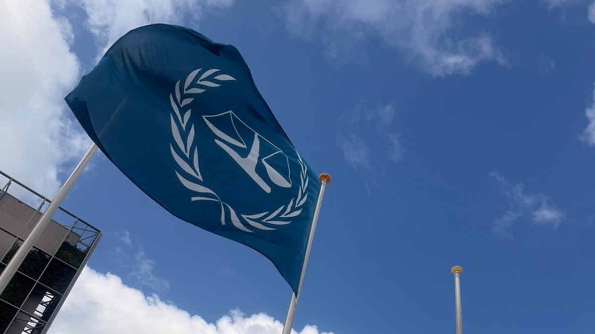 Flag of the International Criminal Court flying outside its headquarters in The Hague